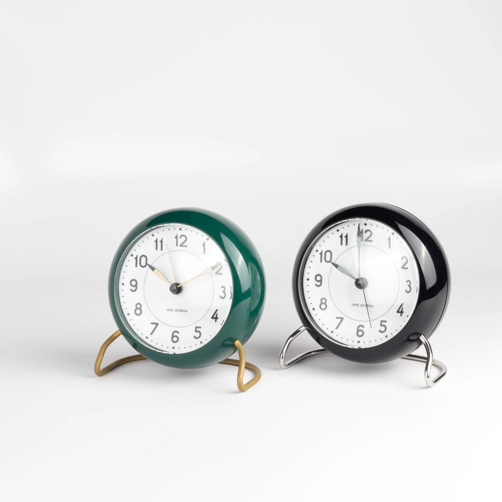 Classic Arne Jacobsen "AJ" Alarm Clock in green and black on white background.  AA batteries not included. 