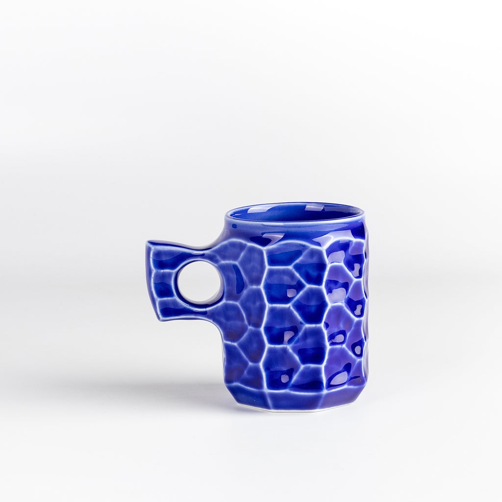 Large Cobalt Blue Ceramic Jincup from Akihiro Woodworks is a collaboration with One Kiln Ceramics utilizing porcelain mud casting and local wood ash in the glaze to achieve the color. Each mug is slightly different from another. Made by Akihiro Woodworks in Kagoshima, Japan.