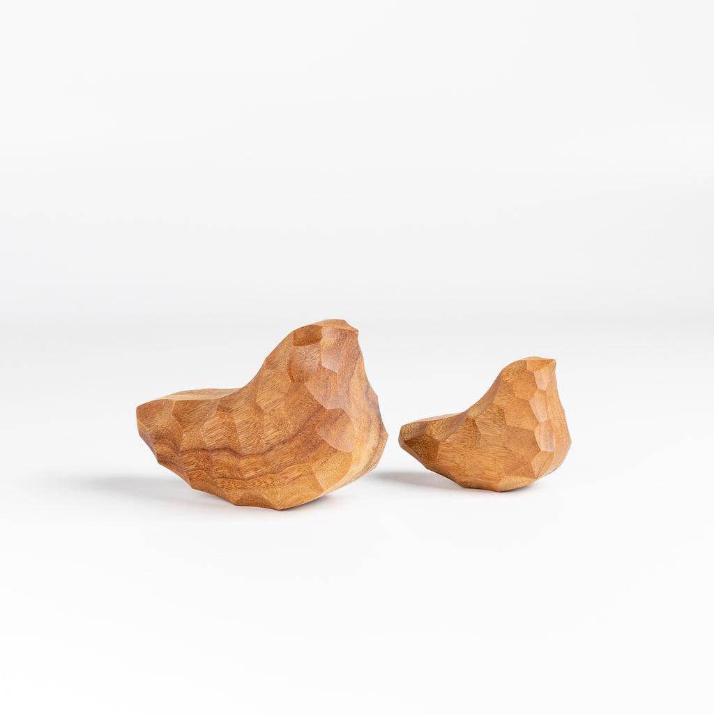 Small and medium Carved Wood Birds "Chicchi" from Akihiro Woodworks is a hand carved bird in tabunoki wood that will sway back and forth when you push on it. Each bird is unique and may vary in color and the appearance of knots in the wood. Made by Akihiro Woodworks in Kagoshima, Japan.