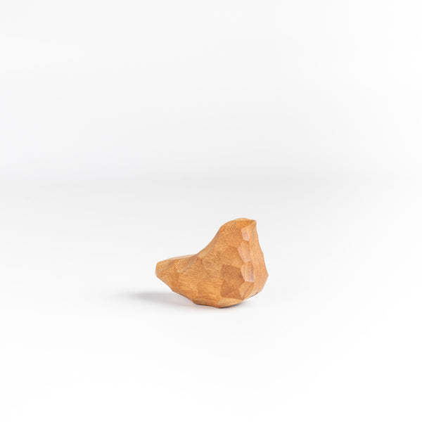 Small Carved Wood Bird "Chicchi" from Akihiro Woodworks is a hand carved bird in tabunoki wood that will sway back and forth when you push on it. Each bird is unique and may vary in color and the appearance of knots in the wood. Made by Akihiro Woodworks in Kagoshima, Japan.
