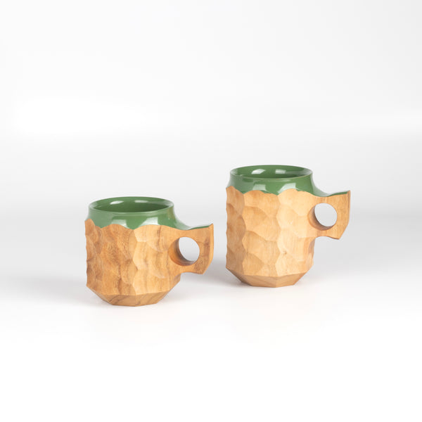 Large and medium Jincups in Hybrid Green Urushi, a carved mug by Akihiro Woodworks, utilizing Tabunoki wood and has green laquer on rim and inside.