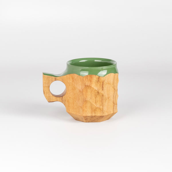 Medium Jincup in Hybrid Green Urushi is a carved mug by Akihiro Woodworks, utilizing Tabunoki wood and has green lacquer on rim and inside.