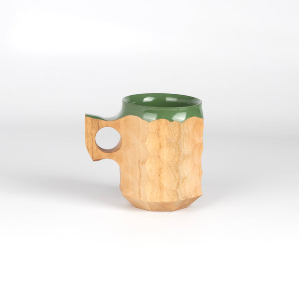 Large Jincup in Hybrid Green Urushi is a carved mug by Akihiro Woodworks, utilizing Tabunoki wood and has green laquer on rim and inside.