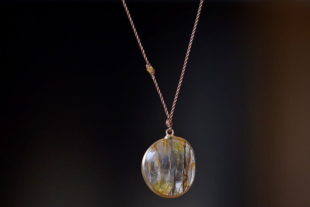 Rutilated Quartz Pendant Necklace with Inclusions by Margaret Solow set in 14k gold.