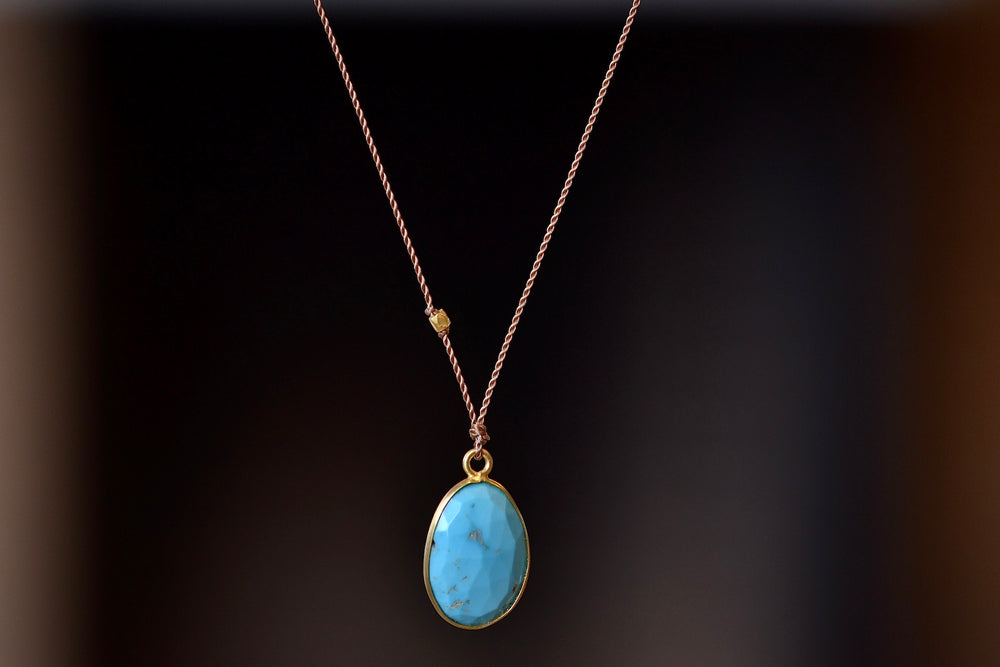 Sleeping Beauty Turquoise Pendant Necklace by Margaret Solow. Set in 18k yellow gold.