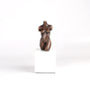 Anne Ricketts Torso Sculpture of modern woman in brass on white background.
