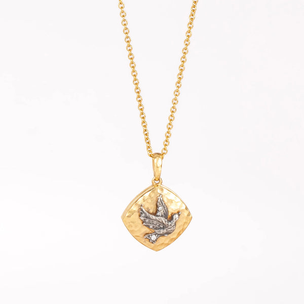 The Bird Sliding Locket by Arman Sarkisyan in 22k gold on white background.
