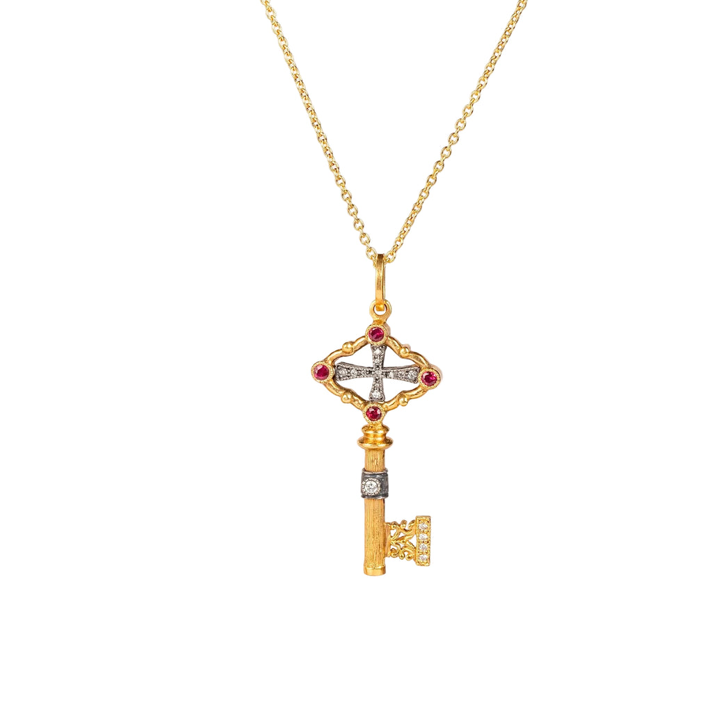 Key pendant necklace by Arman Sarkisyan in gold with rubies and diamonds.
