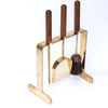 Carl Aubock Brass fireplace tool set with wooden handles on a white background
