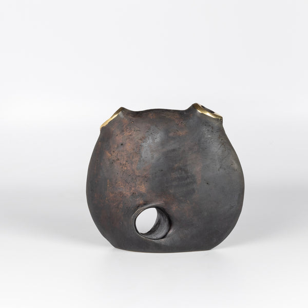Aubock Vase 3789 Moon is a brass vase with patinated body and polished rim.
Designed by Carl Auböck and handmade in Austria. Founded in 1906, the workshop is still owned and operated by the Auböck family (by Carl IV and V) from its original home, in a Vienna townhouse.
OK has the largest selection of current Werkstätte Auböck production in the US and in stock, ready to ship.