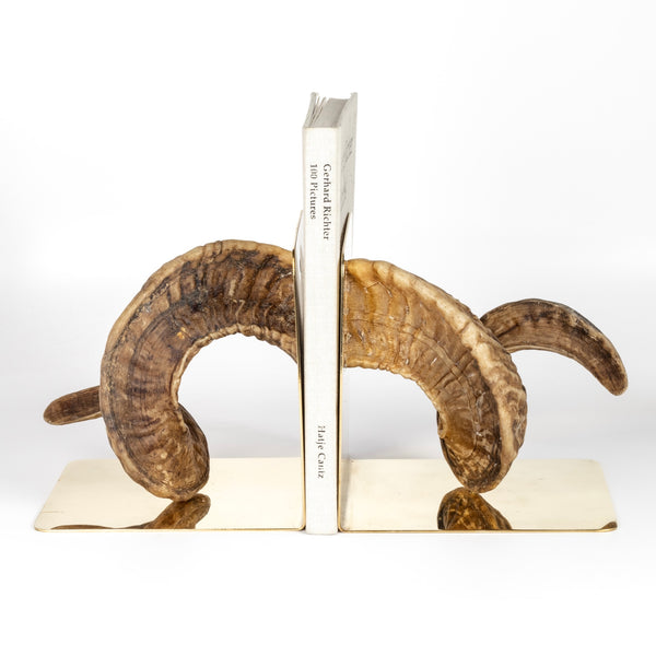 Aubock Bookends 5673 Horn are one of a kind bookends in polished brass designed by Carl Auböck and handmade in Austria. Founded in 1906, the workshop is still owned and operated by the Auböck family (by Carl IV and V) from its original home, in a Vienna townhouse. OK has the largest selection of current Werkstätte Auböck production in the US and in stock, ready to ship. 
