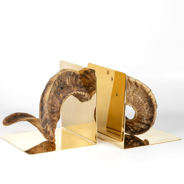 Angled view of Aubock Bookends 5673 Horn are one of a kind bookends in polished brass designed by Carl Auböck and handmade in Austria. 