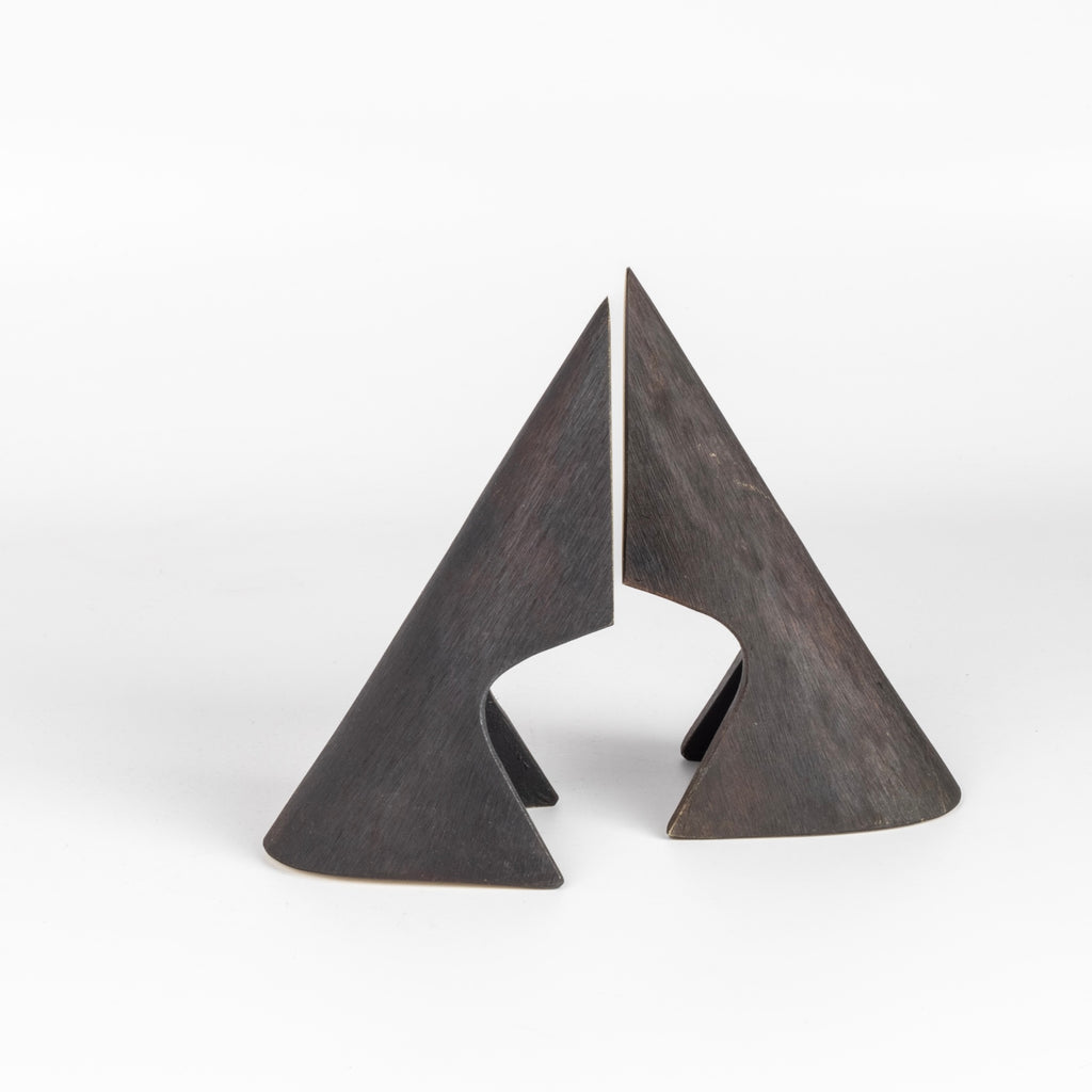 Aubock Bookends 4099 Wedge All Patina designed by Carl Auböck and handmade in Austria. Founded in 1906, the workshop is still owned and operated by the Auböck family (by Carl IV and V) from its original home, in a Vienna townhouse. OK has the largest selection of current Werkstätte Auböck production in the US and in stock, ready to ship.