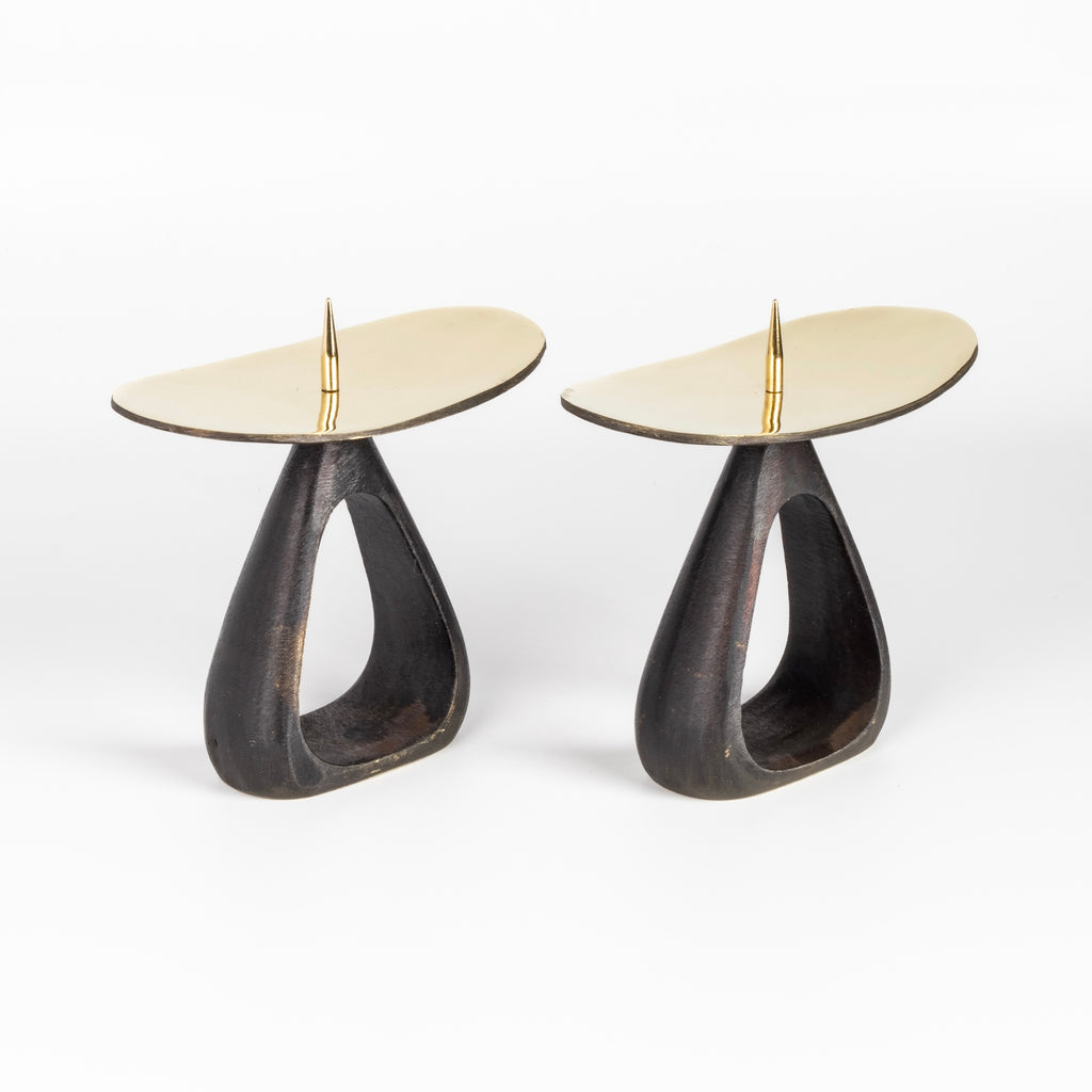 Side view of Aubock Candle Holders 3470 with open base are a set of candle holders with open patina brass base and polished top. 