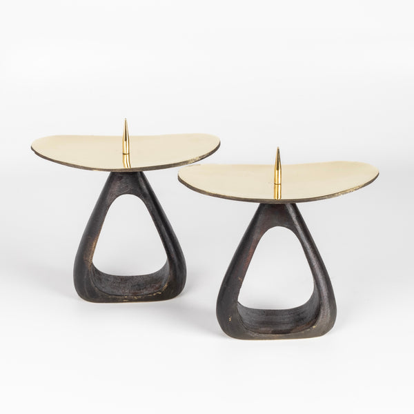 Aubock Candle Holders 3470 with open base are a set of candle holders with open patina brass base and polished top. Designed by Carl Auböck and handmade in Austria. Founded in 1906, the workshop is still owned and operated by the Auböck family (by Carl IV and V) from its original home, in a Vienna townhouse. OK has the largest selection of current Werkstätte Auböck production in the US and in stock, ready to ship.