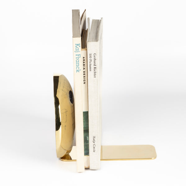 Aubock Bookends 4101 Melies are sculptural bookends in polished and patinated brass with polished base.
Designed by Carl Auböck and handmade in Austria. Founded in 1906, the workshop is still owned and operated by the Auböck family (by Carl IV and V) from its original home, in a Vienna townhouse. OK has the largest selection of current Werkstätte Auböck production in the US and in stock, ready to ship.