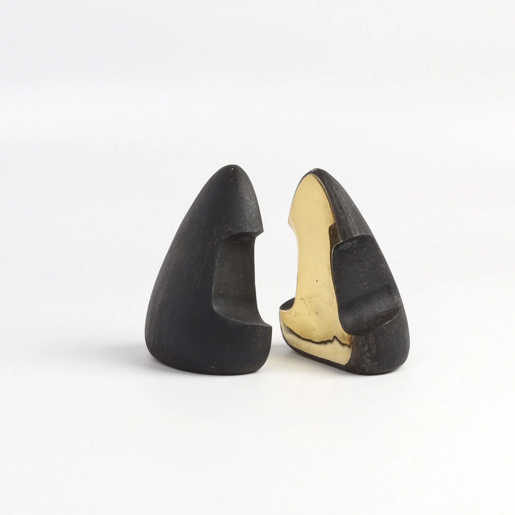 Carl Aubock Bookends 4637 in patina with polished ends on white background. 