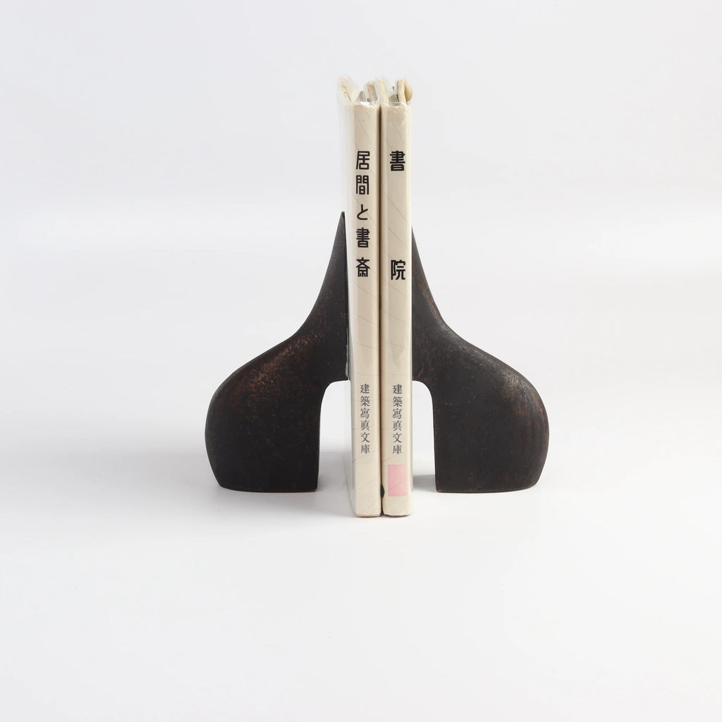 Carl Aubock Bookends 3652 shown holding books.