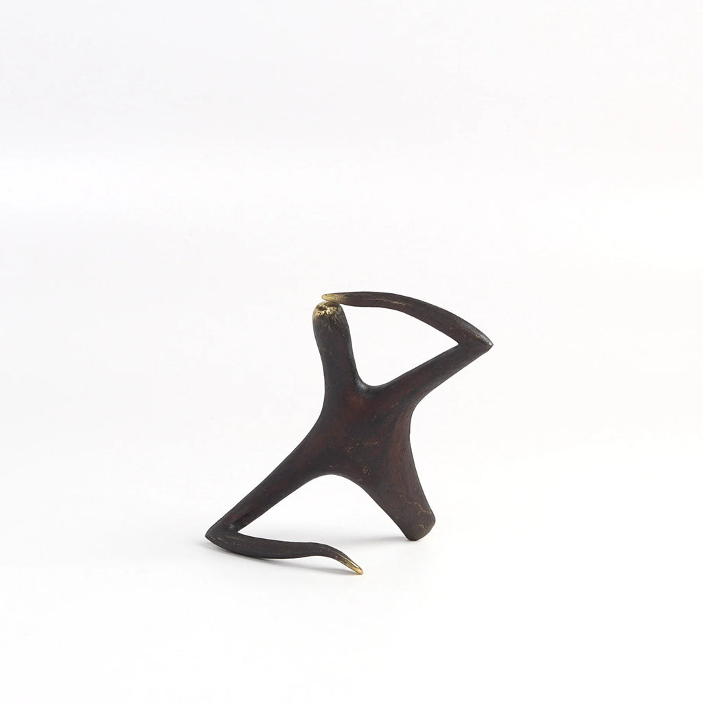 Werkstatte Carl Aubock sculpture Pessmist / Optimist 4059 on white background.