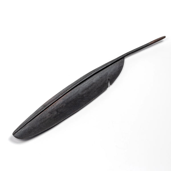 A sculpture of a feather to double as a fountain pen rest 3650 in patina.  Designed by Carl Auböck and handmade in Austria. Founded in 1906, the workshop is still owned and operated by the Auböck family. 