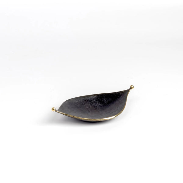 Ashtray Leaf 9431 is an ashtray or bowl shaped like a leaf in patina  brass with polished little balls on each end. Designed by Carl Auböck and handmade in Austria. Founded in 1906, the workshop is still owned and operated by the Auböck family (by Carl IV and from its original home, in a Vienna townhouse.