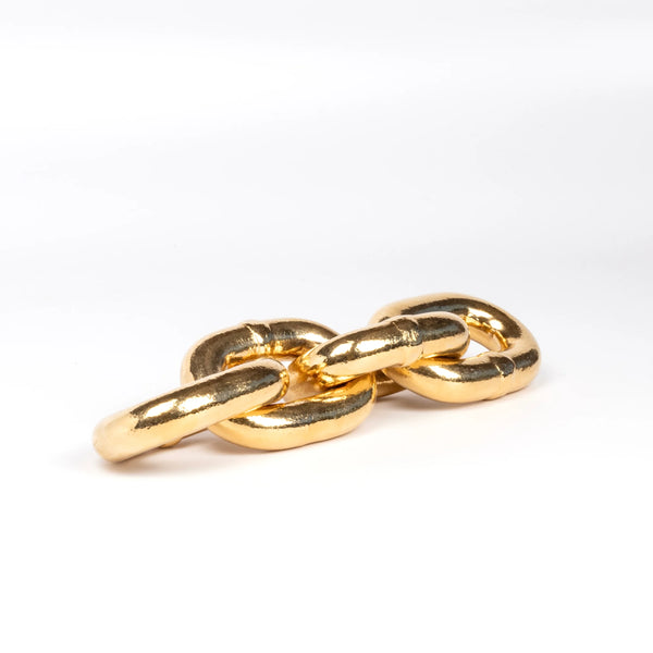 Polished brass plated paperwieight chain by Werkstette Carl Aubock. 5072