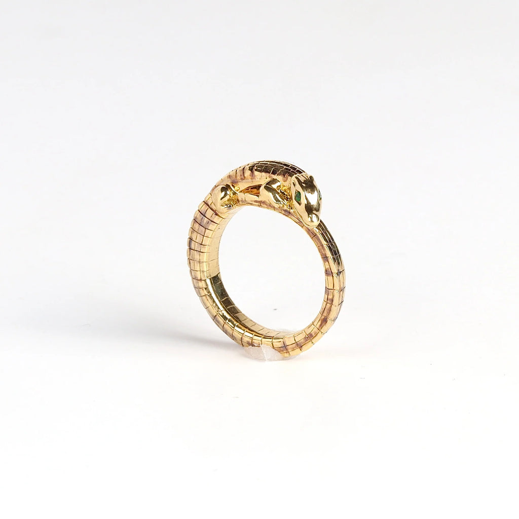 Mini Alligator Wrap ring  with Tsavorite eyes on white background.