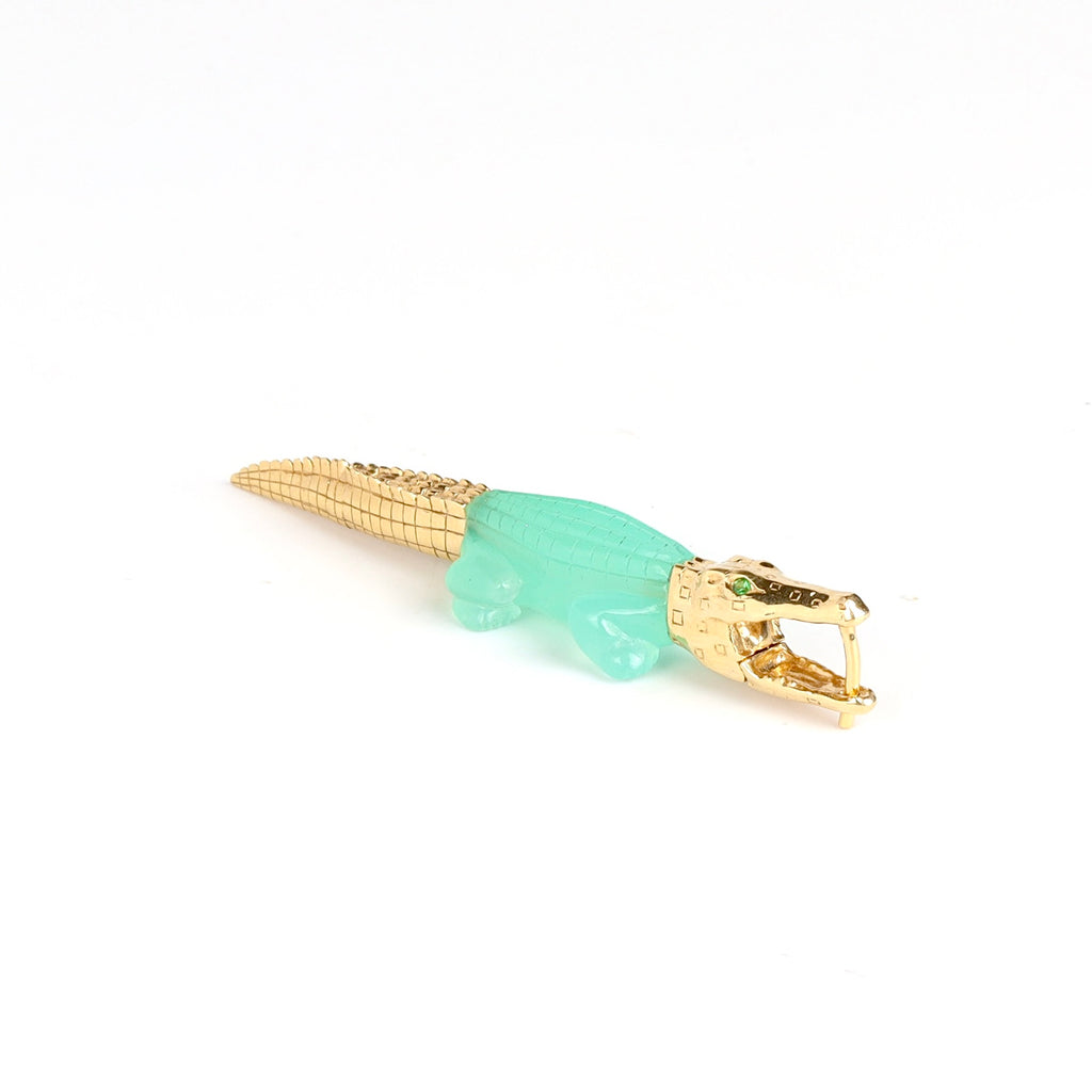 Alligator Bite earring by Bibi Van Der Velden chrysoprase with tsavorite eyes one white background.
