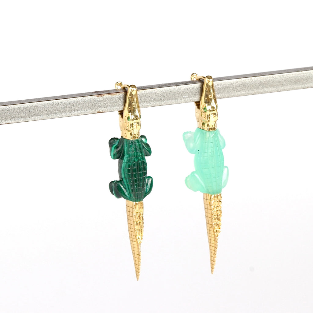 Alligator Bite earring by Bibi Van Der Velden in malachite and chrysoprase with tsavorite eyes one white background.