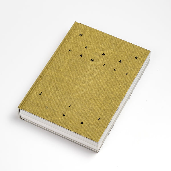 Front cover of "We are Family" Book: History of Jin Cup traces the story of how the Jin cup was developed, sharing many photographs of its iterations and uses. Written by Jin Akihiro, who hopes that "your jincup experience will become one page in the story of your life."