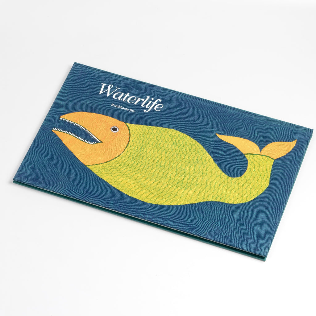 "Waterlife features Mithila art, a vibrant and delicate form of folk painting from Bihar in eastern India." grinning cats, bad cats, cats with scowls and cats with jowls..." Written and illustrated by Rambharos Jha. This book can be thought of as the artist's journal. Hand bound with a silk screened cover, Published in India and numbered in an edition of 3000.