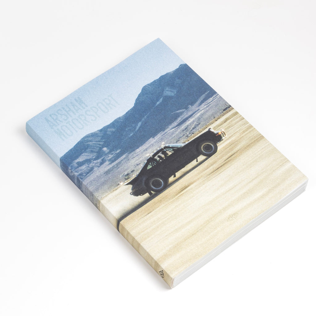 Soft cover volume of First Edition Arsham Motorsport Porsche and art book from ERG Media Daniel Arsham.