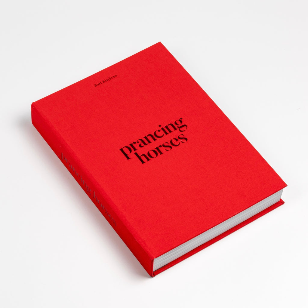 Prancing Horses photo book by Bart Kuykens is the story of Ferrari classic cars and drivers shot in black and white and color utilizing analog photography.