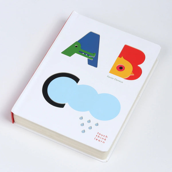 Touch Think Learn ABC book on white background.
