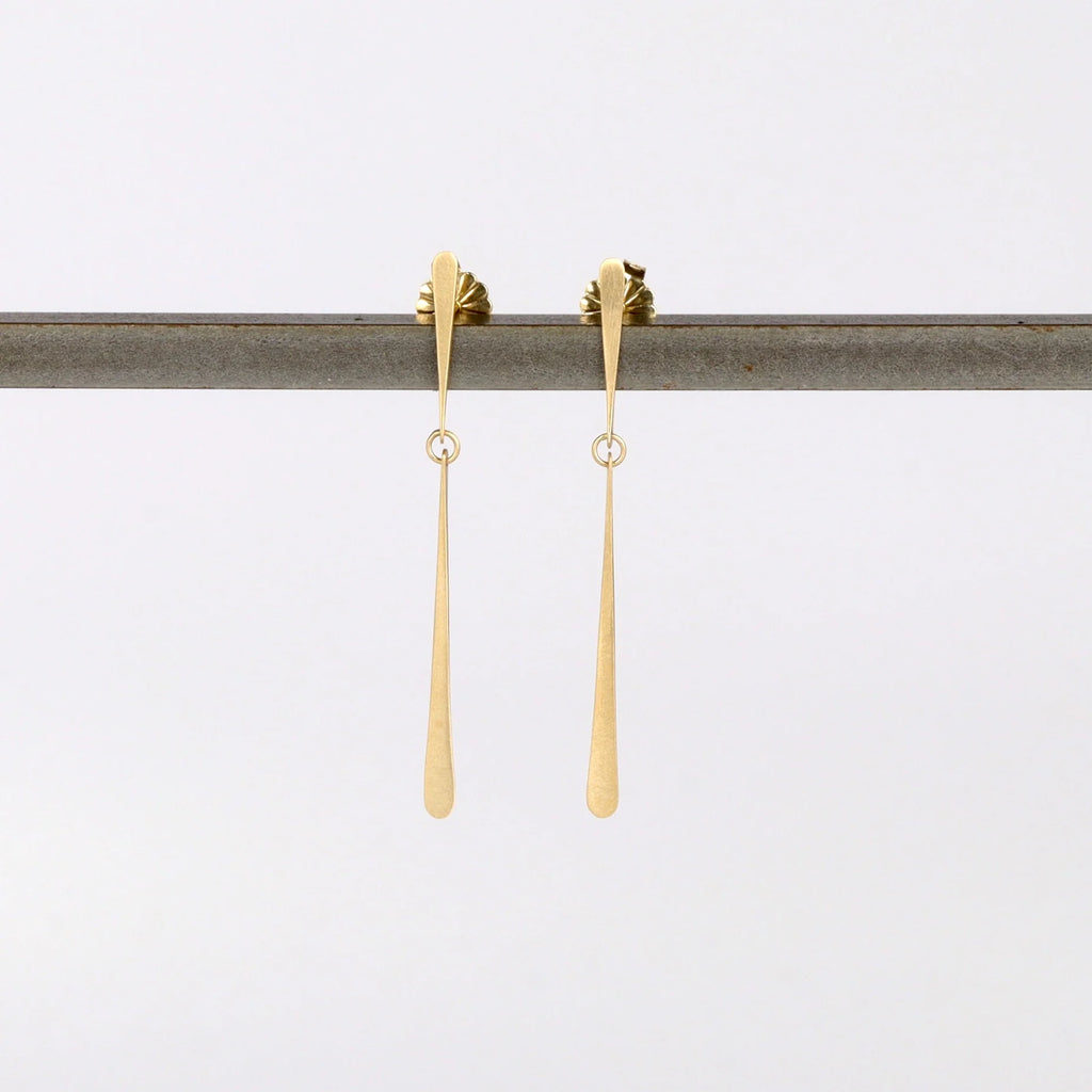 Double Fringe Post Earrings by Carla Caruso on white background are made from one short and one long elongated teardrop fringe connected in the middle with post closure in 14k satin gold, allowing for lots of sparkle. Handmade in Massachusetts.