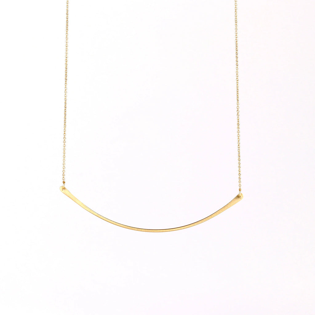 Horizontal Fringe Necklace by Carla Caruso is a  single elongated and shaped fringe bar hangs on an 13.5" chain in 14k yellow gold with satin finish. 