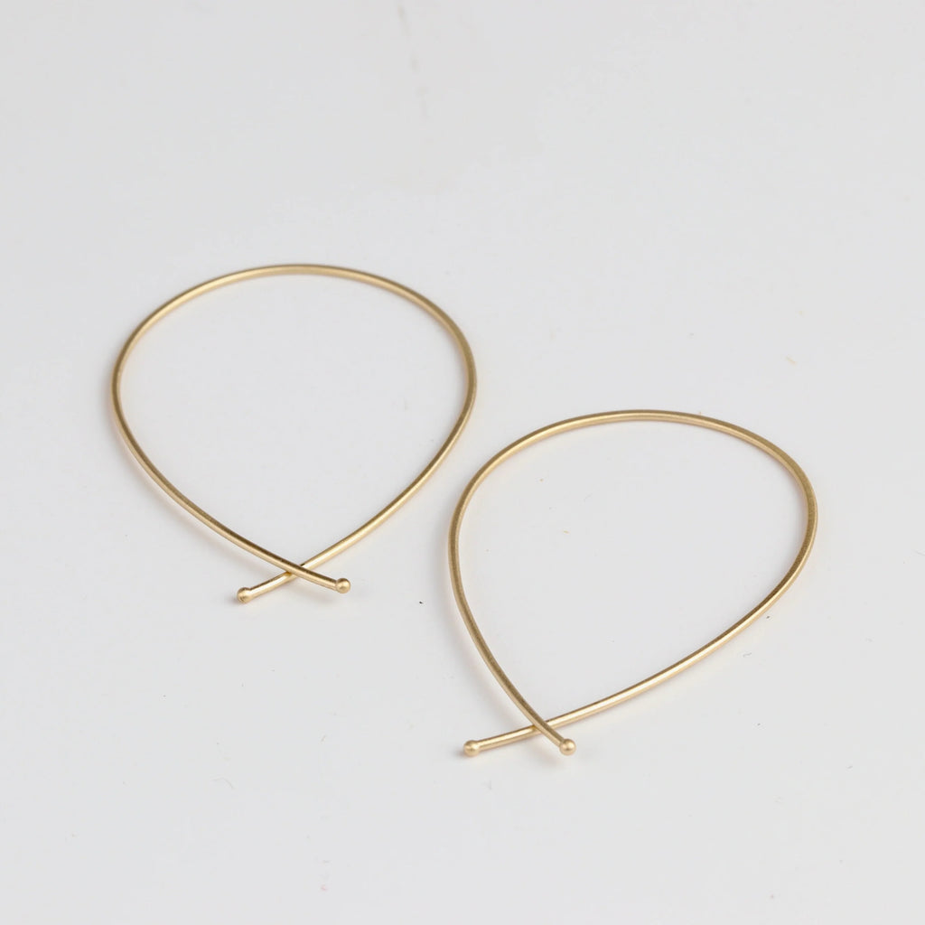 Carla Caruso 14k Yellow Gold Ribbon Hoops in large.