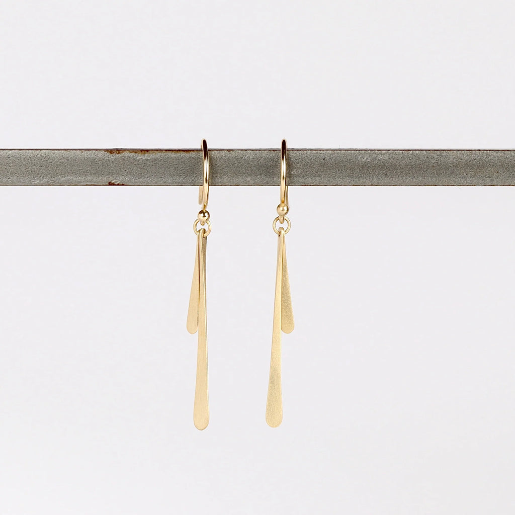Double Fringe Drop Earrings in 14k yellow satin and matte gold by Carla Caruso on white background.