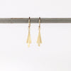 Carla Caruso Triple Fringe Drop earrings on whitr background in 14k yellow satin matte gold. Everyday Elegance.