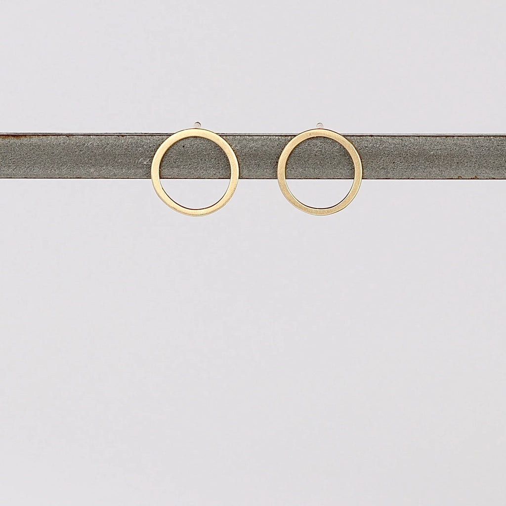 Open Circle Studs Earrings on white background.