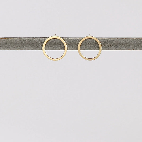 Open Circle Studs Earrings on white background.