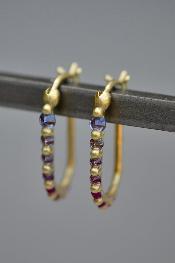 Ularis hoop earrings in purple and oink on gray by Polly Wales.