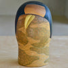 Lifestyle shot of Vintage "Hana Kasumi" is a beautiful Sosaku Kokeshi by master Yoshida Takashi.
