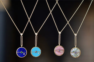 Mix of Retrouvai Compass Pendant Necklaces with stone inlay and accent stones.