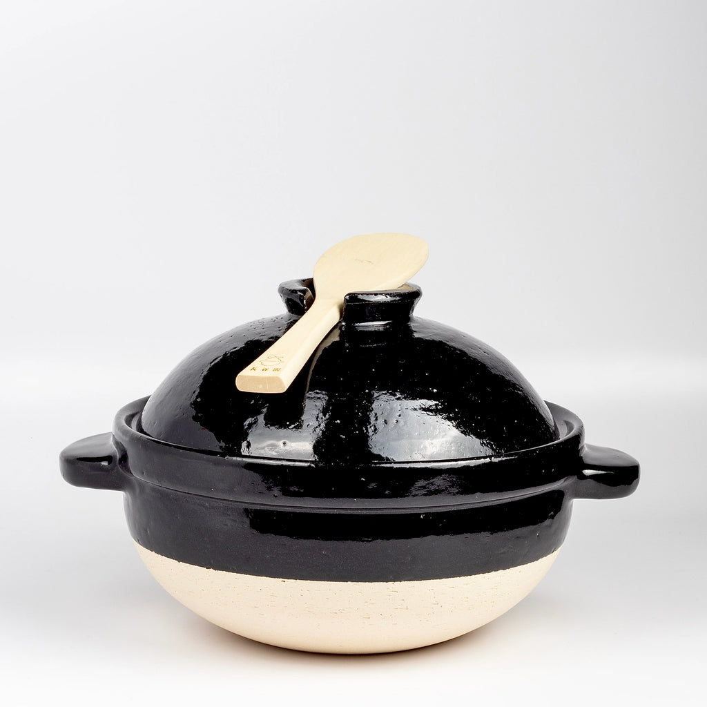 Japanese Donabe clay pot with rice spoon.