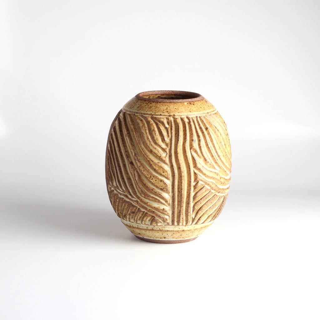 Aone of a kind hand carved Irving Place Studio (IPS) Ceramic Vases in brown made by Dora De Larios (1933-2018) on white background. 