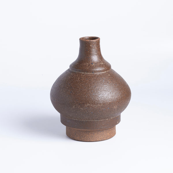 A brown bottle shaped Irving Place Studio (IPS) Vase. Irving Place Studios was started by Dora De Larios and Ellisce Johnston in 1968 in Los Angeles . 