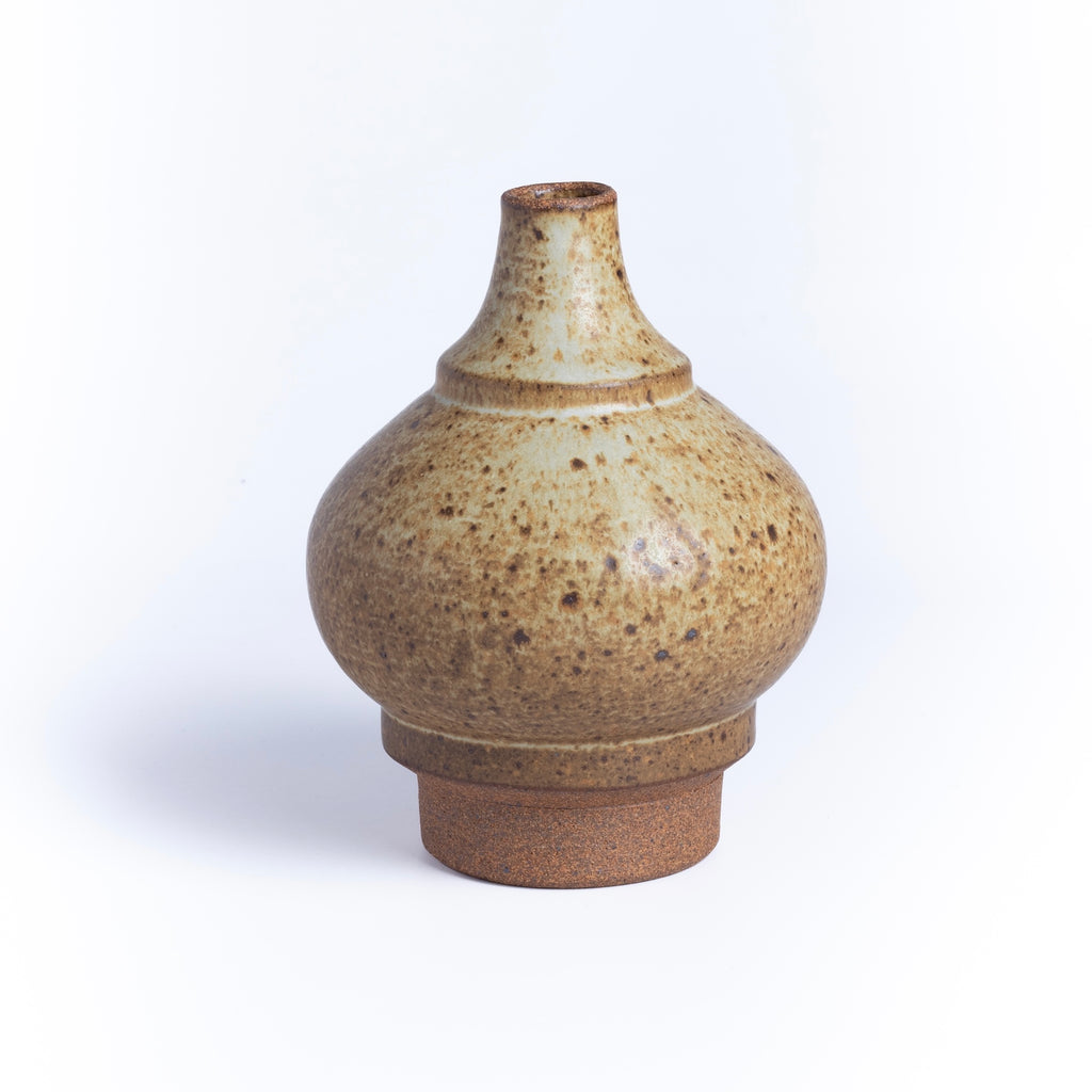A beige and spotted bottle shaped Irving Place Studio (IPS) Vase. Irving Place Studios was started by Dora De Larios and Ellisce Johnston in 1968 in Los Angeles .