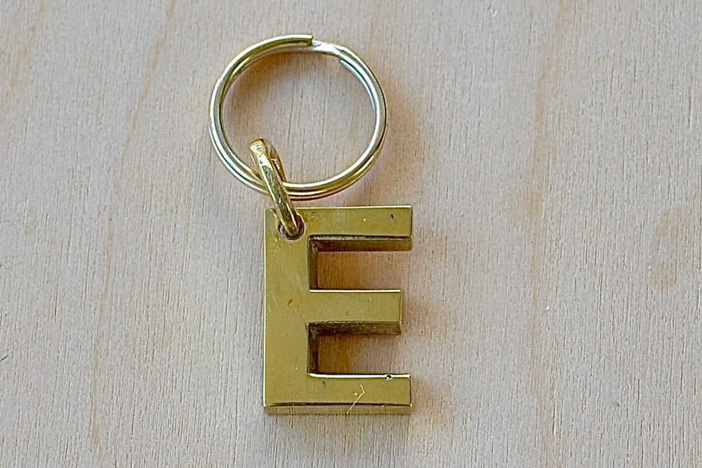 'E' Letter keyring, key chain, key ring in brass made by Carl Aubock. 