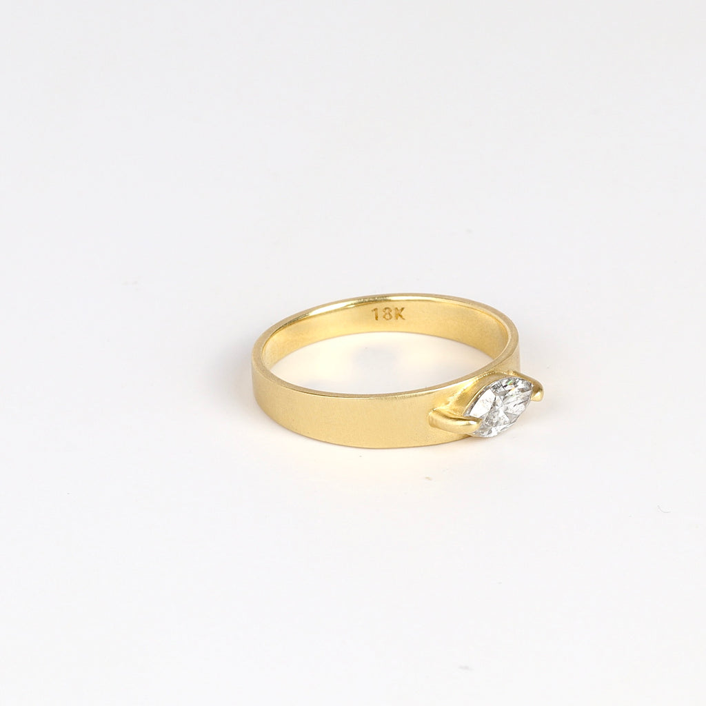 Side view of Slim Cigar Band with Diamond by Elizabeth Street Jewelry on white background.